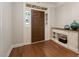 Bright entryway with hardwood floors, front door with sidelights, and decorative console table at 3612 Carriage Dr, Raleigh, NC 27612