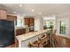 Stylish kitchen with a granite breakfast bar, wood cabinets, and stainless steel appliances at 3612 Carriage Dr, Raleigh, NC 27612