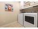 Well-lit laundry room features modern washer and dryer appliances at 3612 Carriage Dr, Raleigh, NC 27612