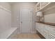 Well-organized mud room featuring built-in shelves, coat hooks, a bench, and ample storage at 3612 Carriage Dr, Raleigh, NC 27612