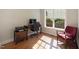 Cozy office space with desk, chair, printer and natural light from a large window at 3612 Carriage Dr, Raleigh, NC 27612
