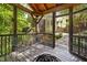 A relaxing, screened-in back porch with metal furniture at 3612 Carriage Dr, Raleigh, NC 27612