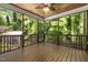 Back porch area with wood ceiling, fan and screened-in views of the wooded lot at 3612 Carriage Dr, Raleigh, NC 27612