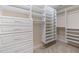 Spacious walk-in closet features custom built-in shelving and ample storage space at 3612 Carriage Dr, Raleigh, NC 27612