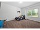 A bedroom with carpet flooring has a colorful bedset and lots of space at 380 Perdues Rd, Louisburg, NC 27549