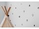 A bedroom has a wall with black tree decal stickers and a white teepee at 380 Perdues Rd, Louisburg, NC 27549