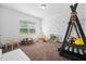 A bedroom with carpet flooring has a fun, creative design with toys and wall decals at 380 Perdues Rd, Louisburg, NC 27549