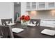 Dining area adjacent to kitchen with decorative vase and seating for four at 380 Perdues Rd, Louisburg, NC 27549