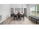 Bright dining area with table set for four, view of bedroom and laundry room at 380 Perdues Rd, Louisburg, NC 27549