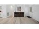Welcoming entryway with sleek floors, built in cabinet and modern decor at 380 Perdues Rd, Louisburg, NC 27549