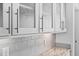 Close-up of the kitchen's stylish white cabinets and matching subway tile at 380 Perdues Rd, Louisburg, NC 27549