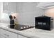 Modern kitchen features sleek black cooktop and marble countertops at 380 Perdues Rd, Louisburg, NC 27549