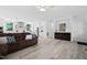 Spacious living room with hardwood floors open to the modern kitchen at 380 Perdues Rd, Louisburg, NC 27549