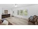 Bright living room featuring lots of natural light and sleek hardwood floors at 380 Perdues Rd, Louisburg, NC 27549