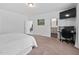 Bright main bedroom features modern decor, a TV, and an ensuite bathroom for added convenience at 380 Perdues Rd, Louisburg, NC 27549