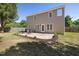 Large backyard features a patio area with a fire pit and seating, perfect for gatherings at 401 Onondaga Ct, Holly Springs, NC 27540