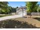 Charming two-story home with a well-manicured lawn, two car garage, and a basketball hoop in the driveway at 401 Onondaga Ct, Holly Springs, NC 27540
