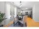 Bright eat-in kitchen showcasing stainless appliances, granite counters, and ample cabinetry at 401 Onondaga Ct, Holly Springs, NC 27540