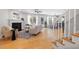 Bright living room featuring a fireplace, hardwood floors and a ceiling fan at 401 Onondaga Ct, Holly Springs, NC 27540