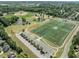 Aerial view of community athletic fields, including baseball, soccer, and tennis facilities at 408 Blooming Meadows Rd, Holly Springs, NC 27540