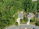 Aerial view of the neighborhood, with trees surrounding the property at 408 Blooming Meadows Rd, Holly Springs, NC 27540