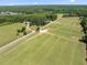 Aerial view of the property featuring a large open grass area at 408 Blooming Meadows Rd, Holly Springs, NC 27540