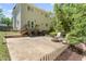 Spacious backyard featuring a patio, fire pit, and seating, perfect for outdoor entertaining at 408 Blooming Meadows Rd, Holly Springs, NC 27540