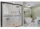 Modern bathroom featuring a glass-enclosed shower, soaking tub, and elegant fixtures at 408 Blooming Meadows Rd, Holly Springs, NC 27540