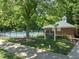 Residents-only Valleyfield community pool with chairs, umbrellas, and a brick building at 408 Blooming Meadows Rd, Holly Springs, NC 27540