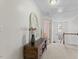 Bright hallway featuring decor, neutral walls, and plush carpeting leading to other areas of the home at 408 Blooming Meadows Rd, Holly Springs, NC 27540