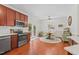 Well-lit kitchen with stainless steel appliances and an adjacent dining area at 408 Blooming Meadows Rd, Holly Springs, NC 27540