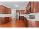 Spacious kitchen featuring stainless steel appliances, ample cabinet space, and stylish backsplash at 408 Blooming Meadows Rd, Holly Springs, NC 27540