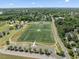 Aerial view showcasing sports fields and parking lot in a community park at 408 Blooming Meadows Rd, Holly Springs, NC 27540