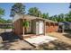 Brick home featuring a concrete patio and rear entrance to the home at 430 Fenton St, Raleigh, NC 27604