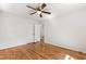 Well-lit bedroom with hardwood floors, double door closet, and neutral walls at 430 Fenton St, Raleigh, NC 27604
