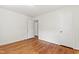 Spacious bedroom with hardwood floors, white walls, a closet, and ample natural light at 430 Fenton St, Raleigh, NC 27604