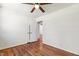 Well-lit bedroom with hardwood floors, white walls, closet, and ceiling fan at 430 Fenton St, Raleigh, NC 27604