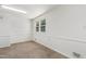 Light-filled room with tiled flooring, neutral walls, and natural light from a large window at 430 Fenton St, Raleigh, NC 27604