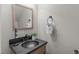 Elegant powder room with a vessel sink, decorative mirror, and stylish fixtures at 4535 Sugarbend Way, Raleigh, NC 27606