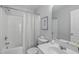 Bathroom with a shower/tub combo, white sink vanity, toilet and a framed floral print at 4535 Sugarbend Way, Raleigh, NC 27606