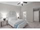 Cozy bedroom with a ceiling fan, a queen bed, and ensuite bathroom access at 4535 Sugarbend Way, Raleigh, NC 27606