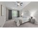 Bright bedroom featuring a ceiling fan, natural light, and tasteful decor at 4535 Sugarbend Way, Raleigh, NC 27606