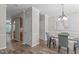 Elegant dining room with hardwood floors, a chandelier, and a table set for a cozy meal at 4535 Sugarbend Way, Raleigh, NC 27606