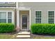 Inviting front entrance with manicured bushes and plants at 4535 Sugarbend Way, Raleigh, NC 27606