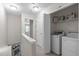 Hallway featuring laundry and storage area at 4535 Sugarbend Way, Raleigh, NC 27606