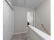 Upstairs hallway featuring carpeting, closet, and bedroom access at 4535 Sugarbend Way, Raleigh, NC 27606