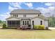Expansive backyard featuring a screened porch, wooden deck, and lush landscaping, offering ideal outdoor living at 46 Bonterra Way, Chapel Hill, NC 27516