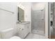 Modern bathroom with a glass-enclosed shower and neutral color palette at 46 Bonterra Way, Chapel Hill, NC 27516