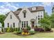 Charming painted-brick home featuring professionally landscaped lawn and a welcoming front entrance at 46 Bonterra Way, Chapel Hill, NC 27516