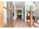 Inviting foyer showcases hardwood floors, staircase, and views into the living room at 46 Bonterra Way, Chapel Hill, NC 27516